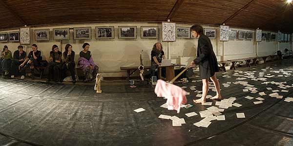 Photo - modern dancer Inna Schwartz recites text by Jean Baudrillard and Sergey Letov follows her by iBook